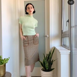 MIDI skirt with pockets and plaid pattern. Purchased in Taiwan. Elastic back.